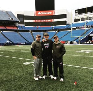 Cornell Assistant Equipment Manager Nick Bruner with Buffalo Bills Spencer Haws, Assistant Director of Equipment Operations, and Jeff Mazurek, Bills Director of Equipment Operations.
